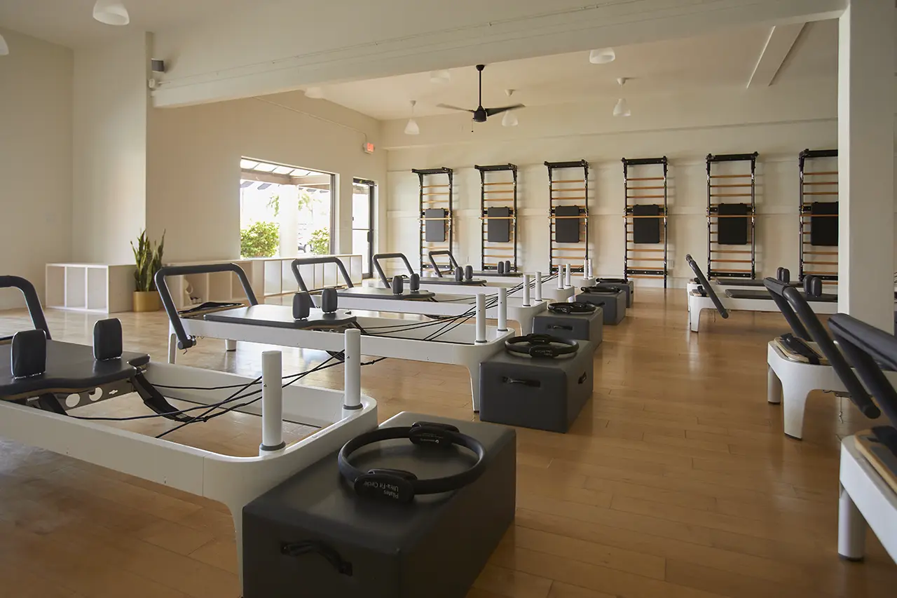 Instructor on a Reformer machine